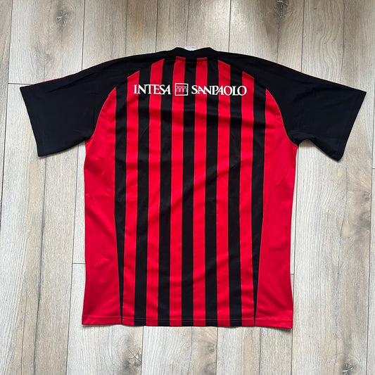 AC Milan Academy x Dolce & Gabbana 2008/09 Home Tee is a black and red striped football shirt with black short sleeves. The chest features AC Milan Academy and Dolce & Gabbana Junior logos on the sides, and a adidas logo in the center. Made with Clima365 technology.