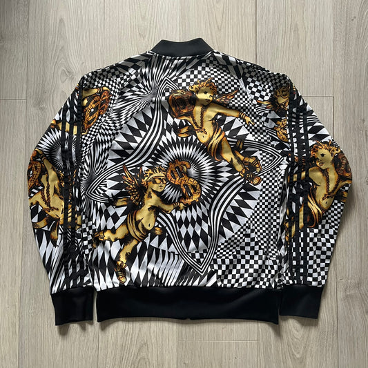 Black and white checkered jacket with gold angel designs on a wooden floor background