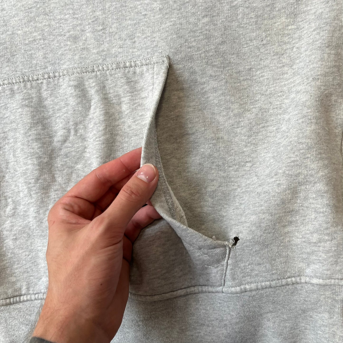 Angry Birds Three Star 2012 Foreman Pig Gray Hoodie features a grey hoodie design with a 3D-style front graphic of Foreman Pig, showing his recognizable eyes, nose, and mustache details. The back features a grey circular "Three Star" Angry Birds graphic, while the inside of the hood is finished with an orange lining.