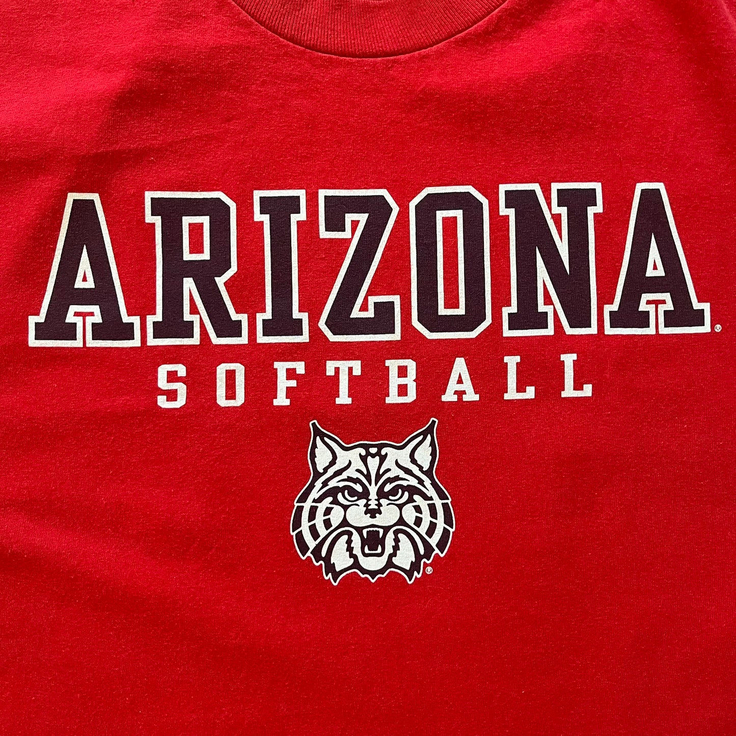 Red t-shirt with 'Arizona Softball' text and a logo on a red background