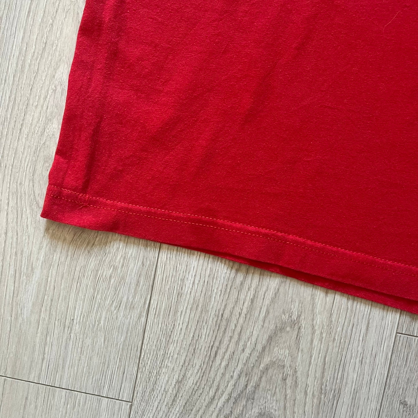 Red fabric on a wooden floor
