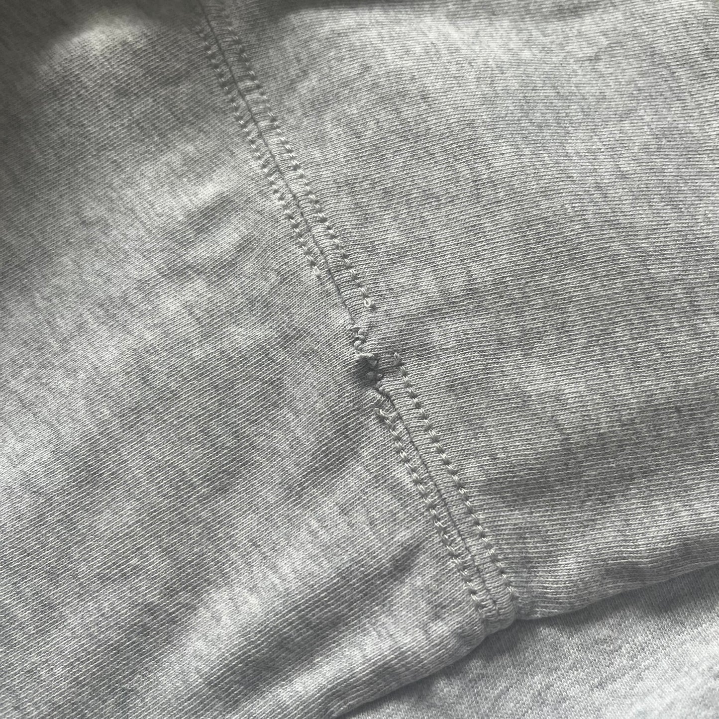 Close-up of a gray fabric with stitching detail
