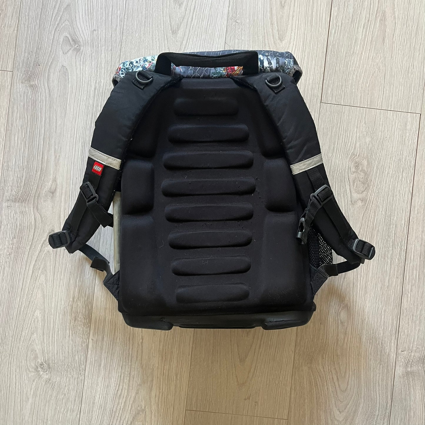 Rare 2007 Bionicle Inika "Toa Nuparu" school backpack made by Grown Up Licenses Limited under The Lego Group. Features a 3D molded Toa Nuparu head on the lower front pocket and a fully printed velcro top compartment with Bionicle figures. Spacious, durable, and reinforced for structure. A standout collectible for any true Bionicle fan.