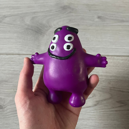 Official CPFM x McDonald’s Grimace collectible from the FW22 drop. The purple figure showcases the McDonald’s icon reimagined with CPFM’s four-eye design. Released October 3rd, 2022, as part of the limited adult Happy Meal collection, licensed on the back.