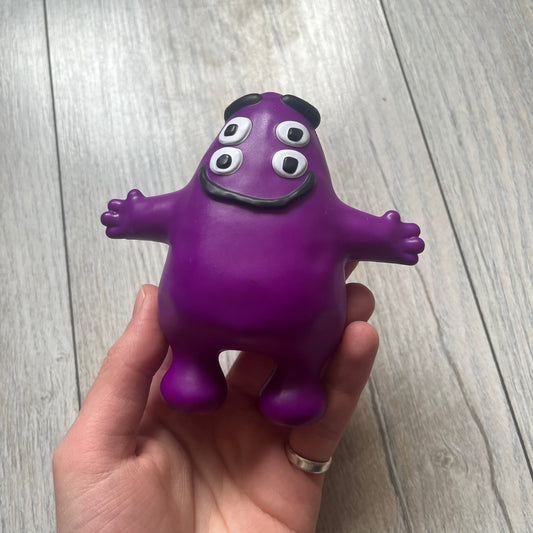 Official CPFM x McDonald’s Grimace collectible from the FW22 drop. The purple figure showcases the McDonald’s icon reimagined with CPFM’s four-eye design. Released October 3rd, 2022, as part of the limited adult Happy Meal collection, licensed on the back.