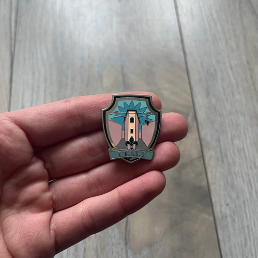 Original physical Counter-Strike: Global Offensive Series 1 Italy pin, produced as official Valve merchandise. These pins were sold at Valve-sponsored CS:GO Major events and later via the official WeLoveFine store, and originally included a code to unlock a “Genuine” Italy pin for the user’s Steam profile. This example comes with the original packaging; the code has been scratched (by me) but remains unused.