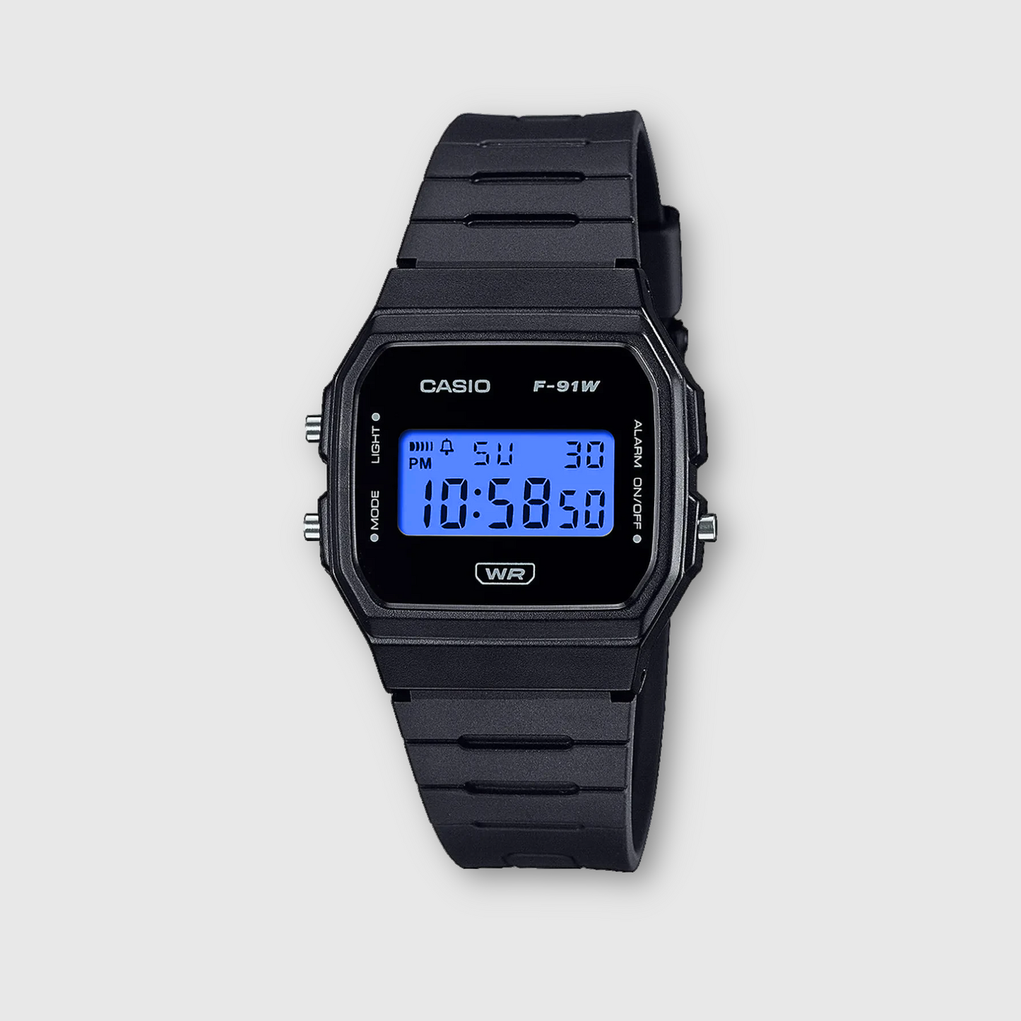 Black Casio digital watch on a light gray background