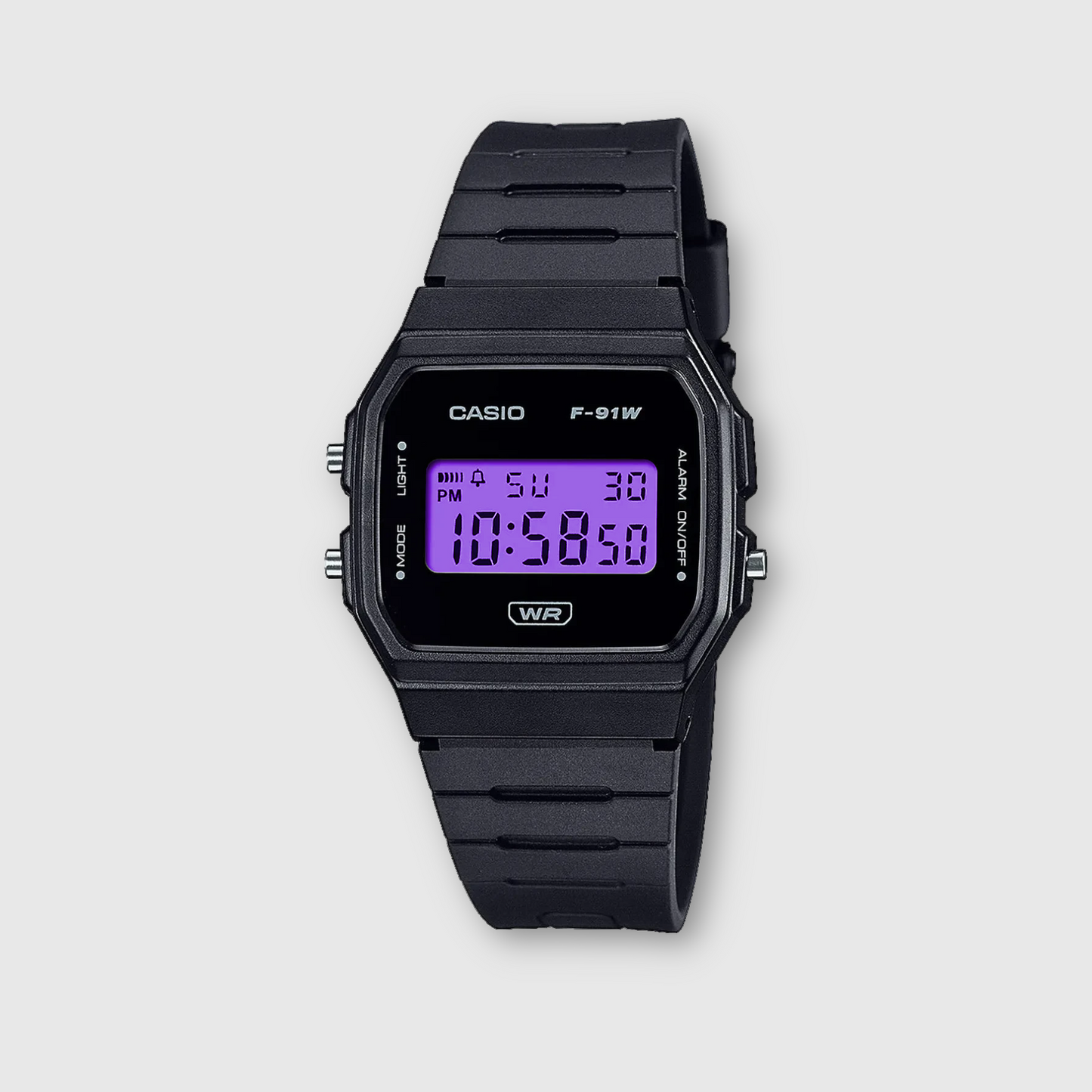 Black Casio digital watch on a light gray background