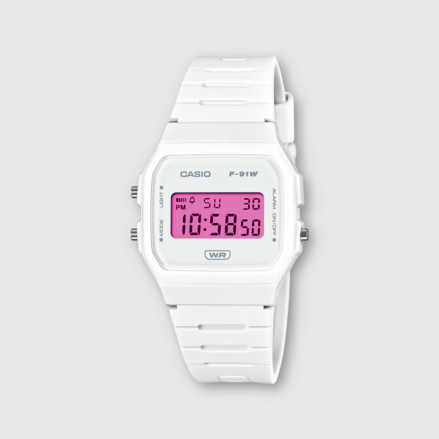 White Casio digital watch with pink display on a light gray background
