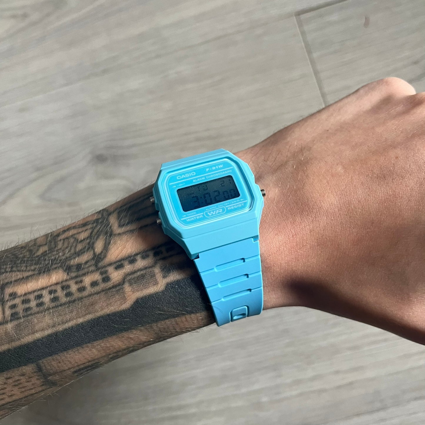 Custom Casio F-91W Baby Blue digital watch featuring a Gradient Blue filter screen. Slim 8.5 mm profile, lightweight 21 g build and flexible bio-based resin band ensure lasting comfort. Includes alarm, stopwatch, and microlight function for everyday functionality.