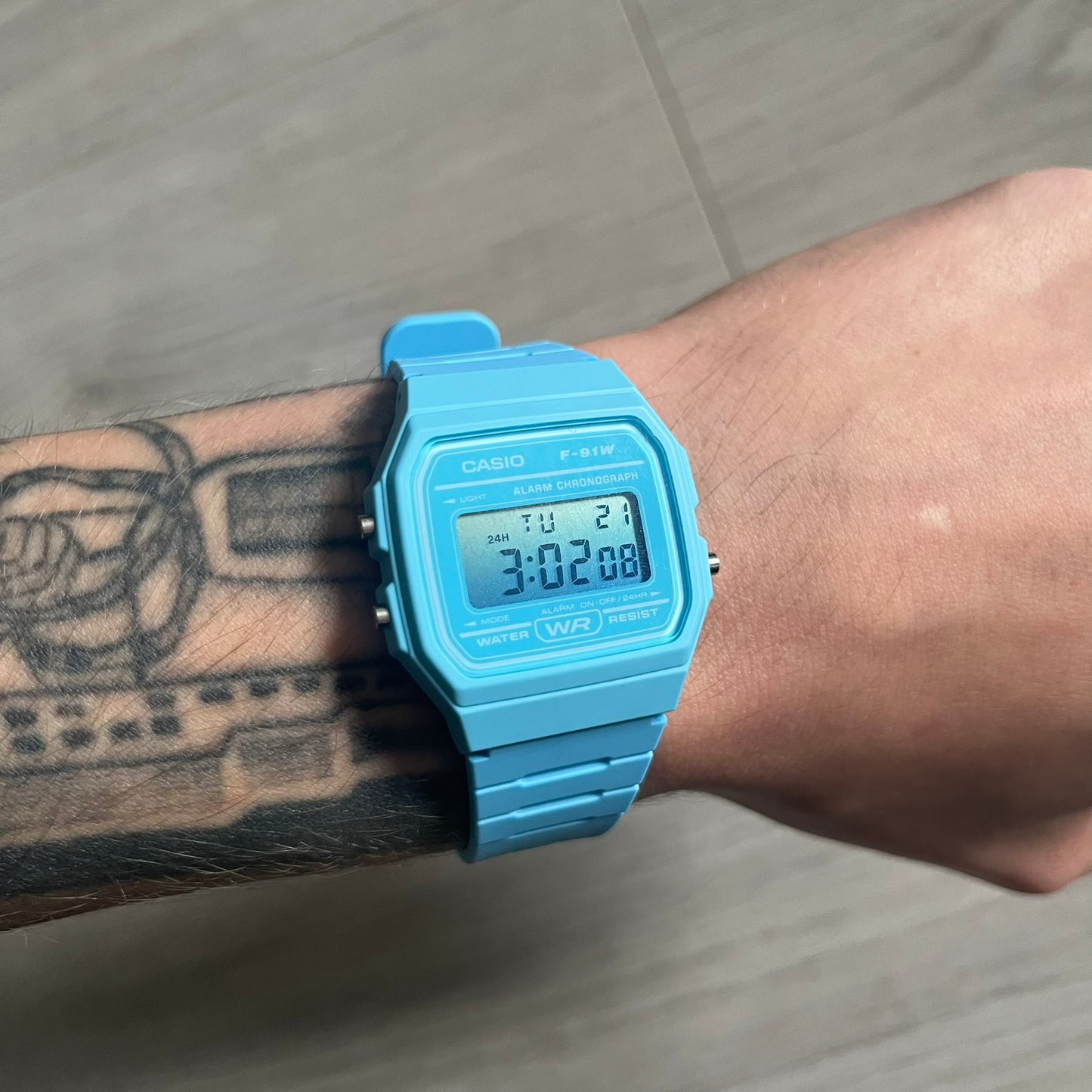 Custom Casio F-91W Baby Blue digital watch featuring a Gradient Blue filter screen. Slim 8.5 mm profile, lightweight 21 g build and flexible bio-based resin band ensure lasting comfort. Includes alarm, stopwatch, and microlight function for everyday functionality.