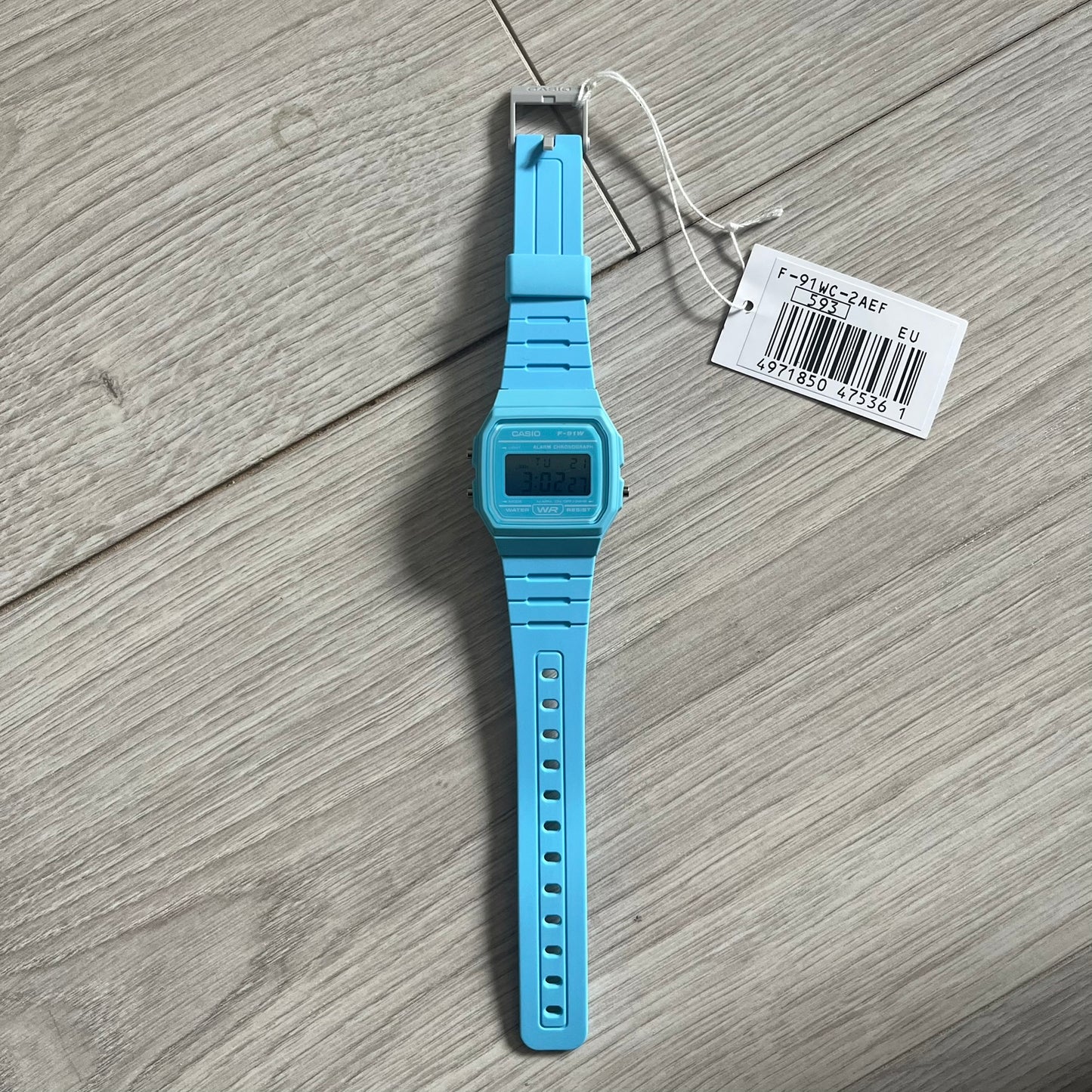 Custom Casio F-91W Baby Blue digital watch featuring a Gradient Blue filter screen. Slim 8.5 mm profile, lightweight 21 g build and flexible bio-based resin band ensure lasting comfort. Includes alarm, stopwatch, and microlight function for everyday functionality.