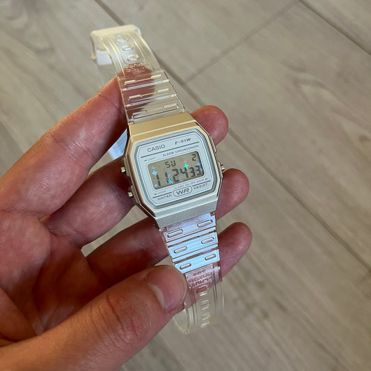 Custom Casio F-91W Clear/Transparent digital watch featuring a Holographic stars filter screen. Slim 8.5 mm profile, lightweight 21 g build and flexible bio-based resin band ensure lasting comfort. Includes alarm, stopwatch, and microlight function for everyday functionality.