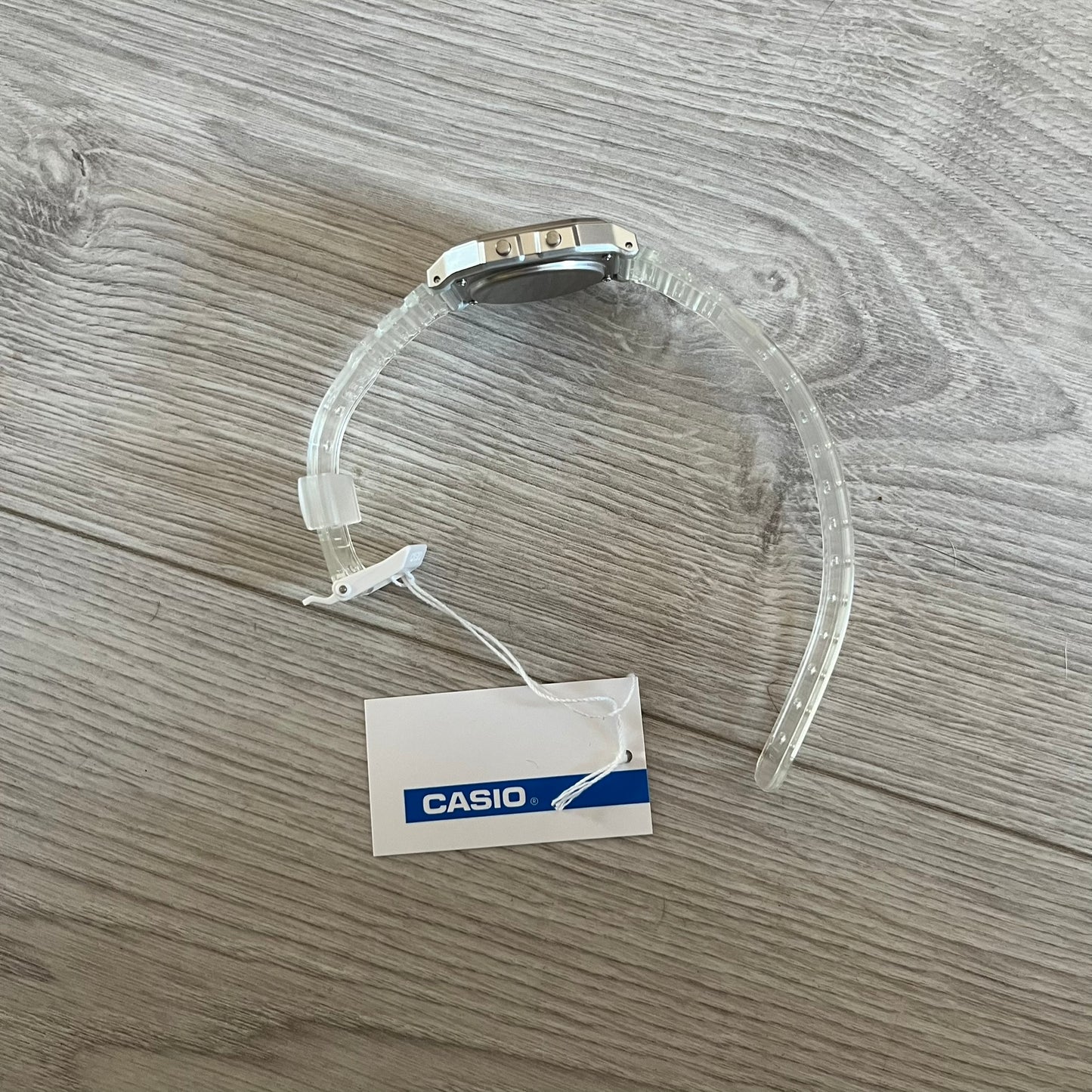 Custom Casio F-91W Clear/Transparent digital watch featuring a Money graphic filter screen. Slim 8.5 mm profile, lightweight 21 g build and flexible bio-based resin band ensure lasting comfort. Includes alarm, stopwatch, and microlight function for everyday functionality.