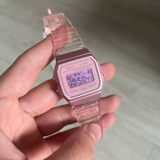 Custom Casio F-91W Pink digital watch featuring a Pink Leopard print filter screen. Slim 8.5 mm profile, lightweight 21 g build and flexible bio-based resin band ensure lasting comfort. Includes alarm, stopwatch, and microlight function for everyday functionality.