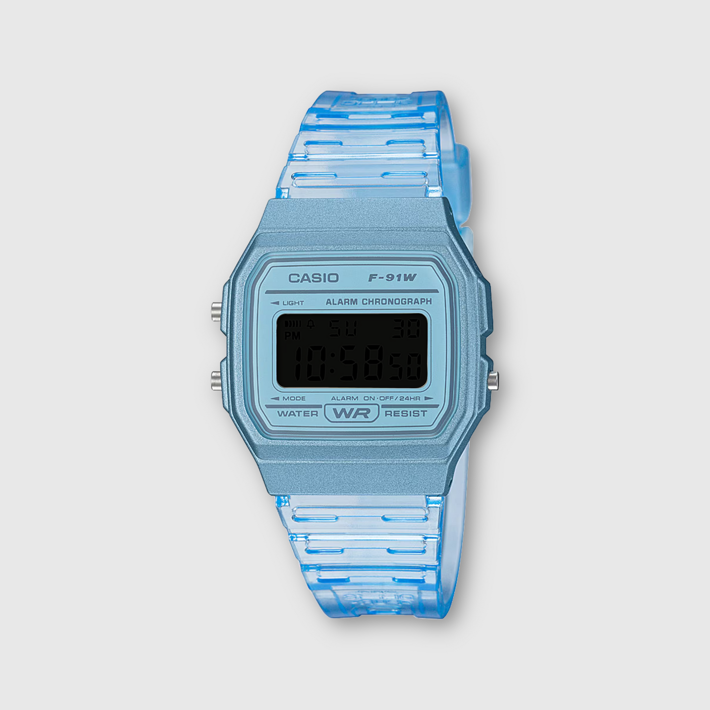 Blue Casio digital watch with a transparent strap on a light gray background