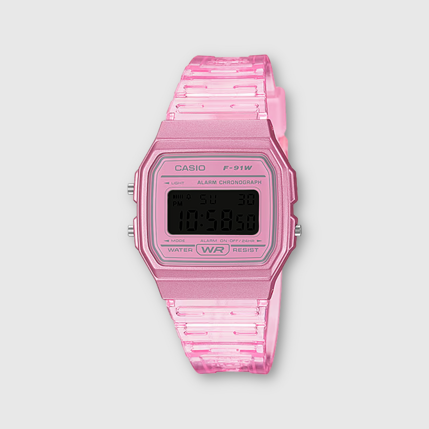 Pink Casio digital watch on a light gray background