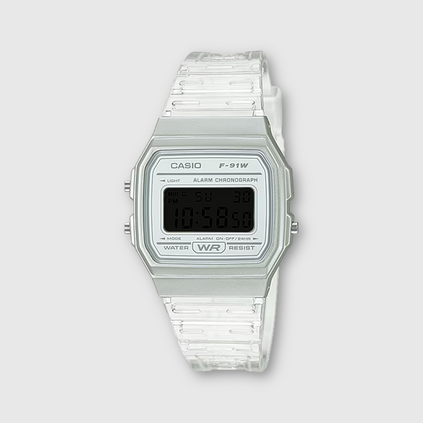 Casio digital watch with clear strap on a light gray background