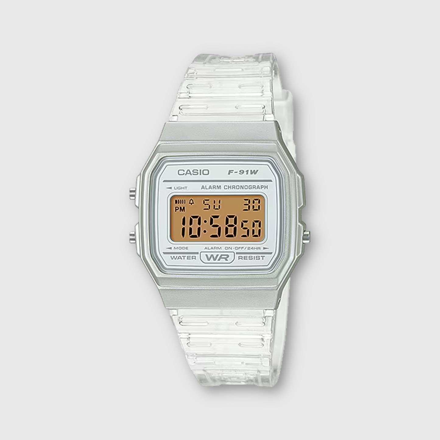 Casio digital watch with clear strap on a light gray background