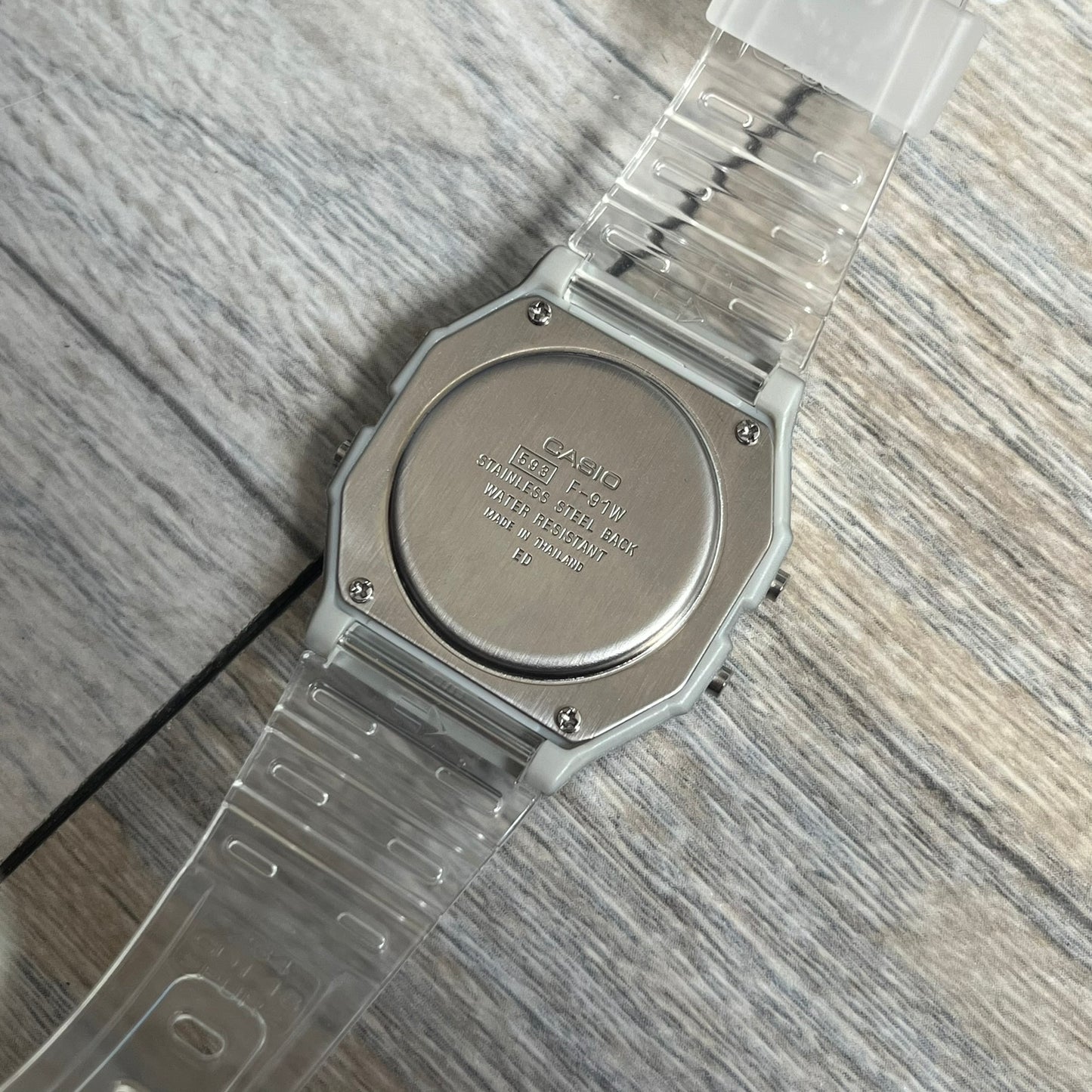 Custom Casio F-91W Clear/Transparent digital watch featuring a see through/clear filter screen. Slim 8.5 mm profile, lightweight 21 g build and flexible bio-based resin band ensure lasting comfort. Includes alarm, stopwatch, and microlight function for everyday functionality.