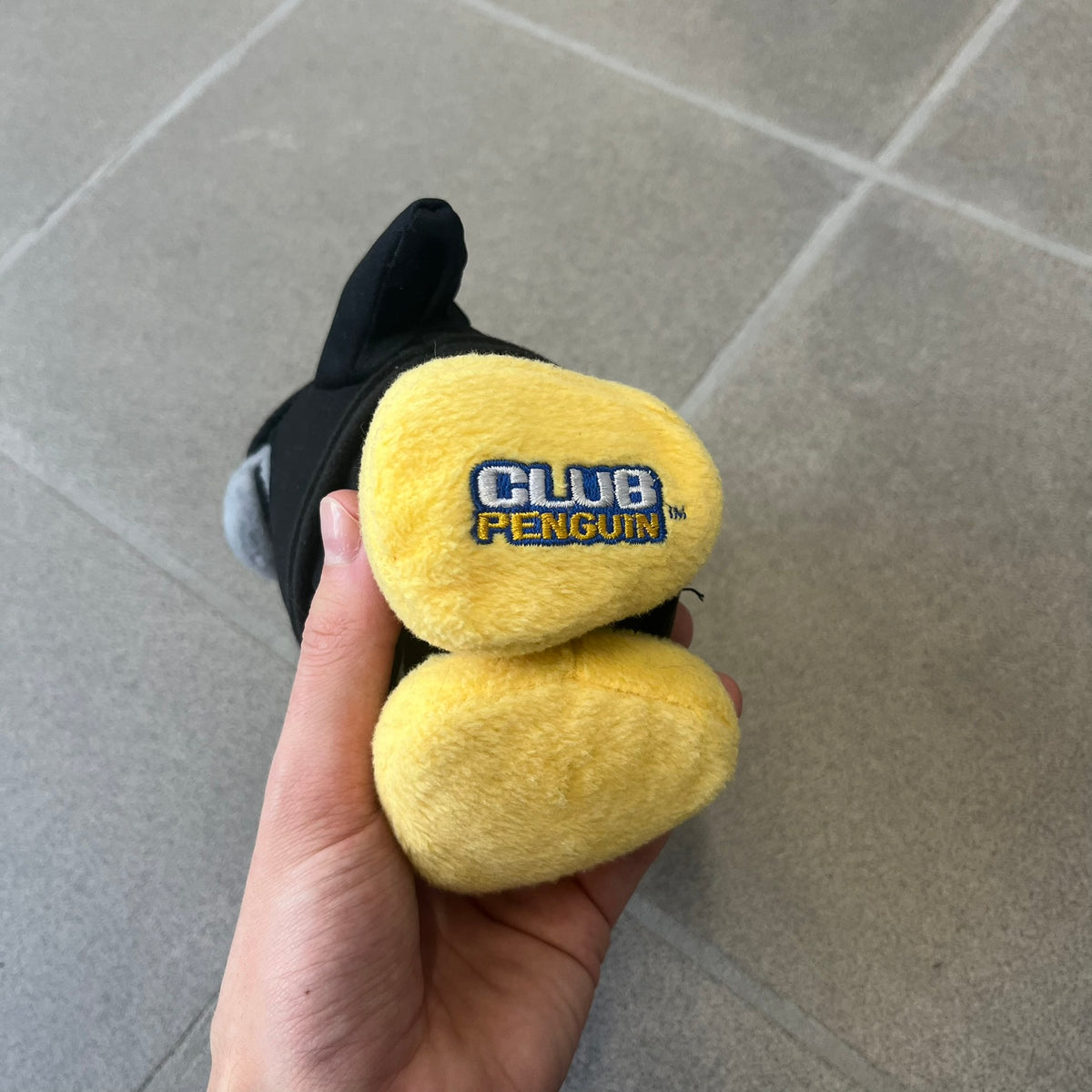 Club Penguin 2009 Series 4 Ninja Penguin Plushie is a black penguin with a black ninja outfit (top+mask) that can be taken off. Released in 2009 by Disney and Jakks Pacific, featuring an embroidered Club Penguin logo on the bottom of the foot. It comes with a Disney-licensed tag.