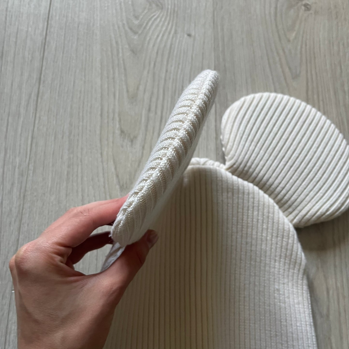Released in Autumn/Winter 2018, this Comme des Garçons beanie playfully reimagines the classic knit hat with ‘Mickey Mouse’-inspired ears. Crafted in an off-white shade with ribbed detailing, it balances fun design with signature CDG avant-garde flair. A standout seasonal accessory with a collectible edge.