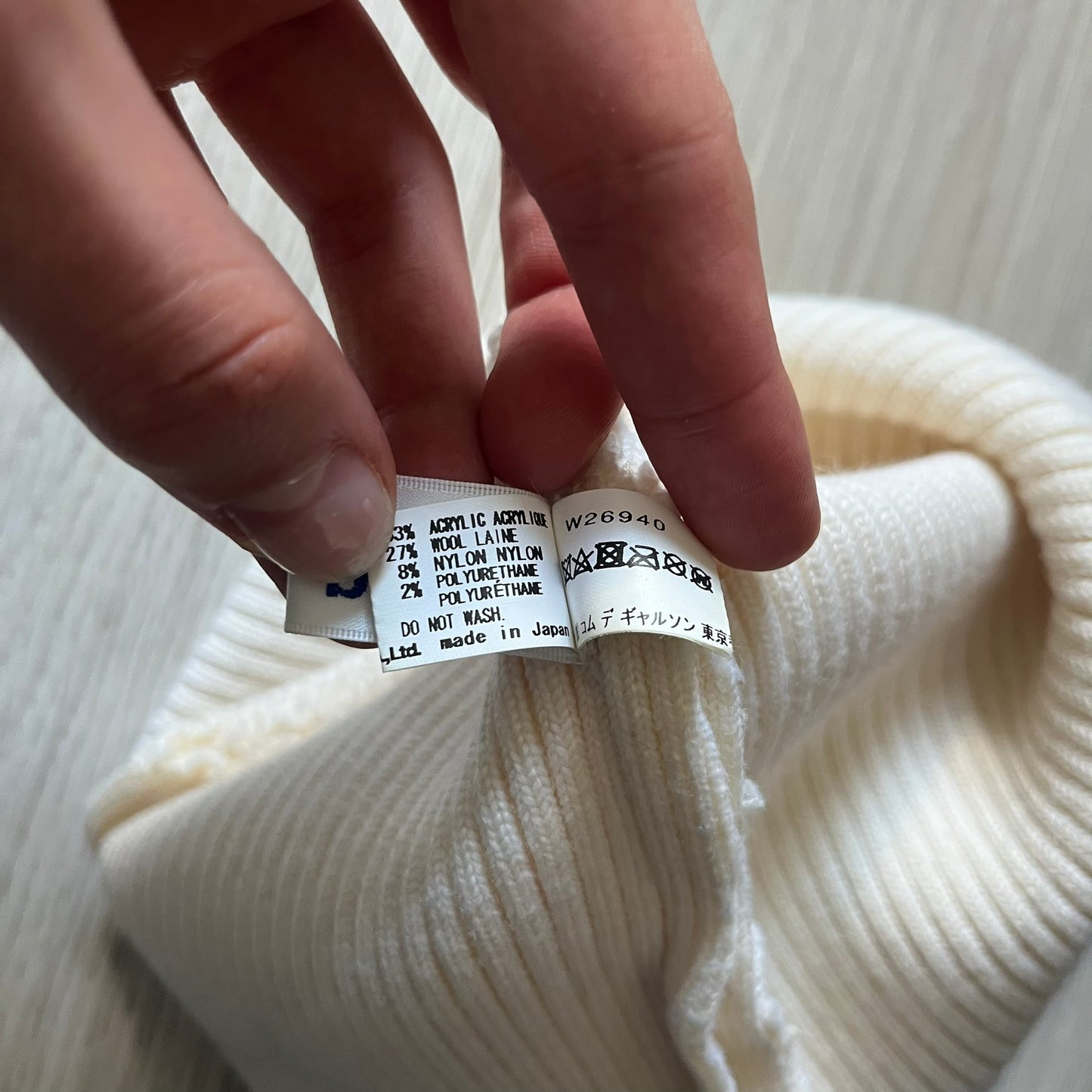 Released in Autumn/Winter 2018, this Comme des Garçons beanie playfully reimagines the classic knit hat with ‘Mickey Mouse’-inspired ears. Crafted in an off-white shade with ribbed detailing, it balances fun design with signature CDG avant-garde flair. A standout seasonal accessory with a collectible edge.