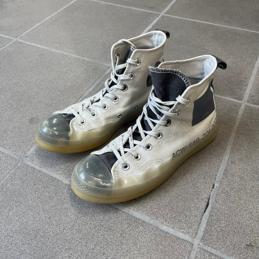 Converse x A-COLD-WALL* Silver Birch Chuck 70 (A02276C) is a limited-edition high-top sneaker from the collaboration with British designer Samuel Ross, released October 6, 2022 in a Silver Birch/Pavement colorway. The canvas upper features a rubber toe cap and a Converse heel plate, with a distinctive translucent, marbled speckled sole.