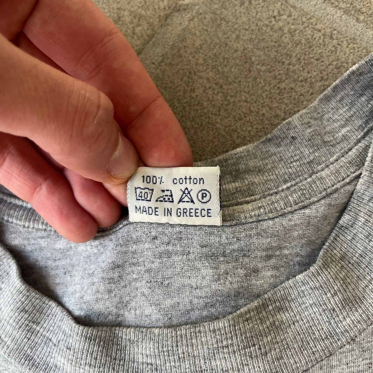 Counter Strike 2000's Bootleg Gray Tee is a gray, 100% cotton European bootleg made in Greece on an "Apple T-Shirt" blank, featuring a CS 1.6 counter-terrorist model T-posing on the front with "Counter-Strike" text printed below.