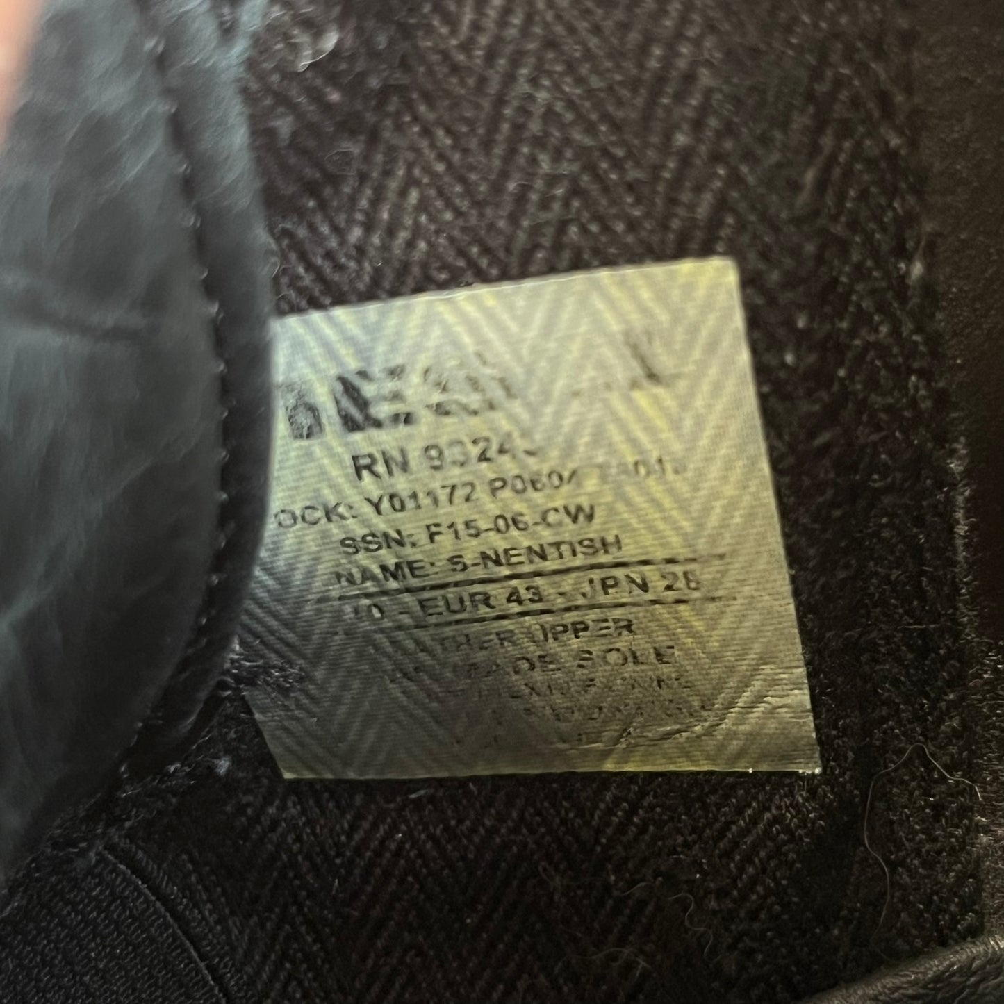 Diesel Zip-Round S-Nentish Black Sneakers feature a high-top silhouette with a black leather upper and a white rubber sole. The sneakers have a full-length zipper detail around the ankle area, running from the top of the shoe down and around the sides. The design includes a lace-up front and Diesel branding details.