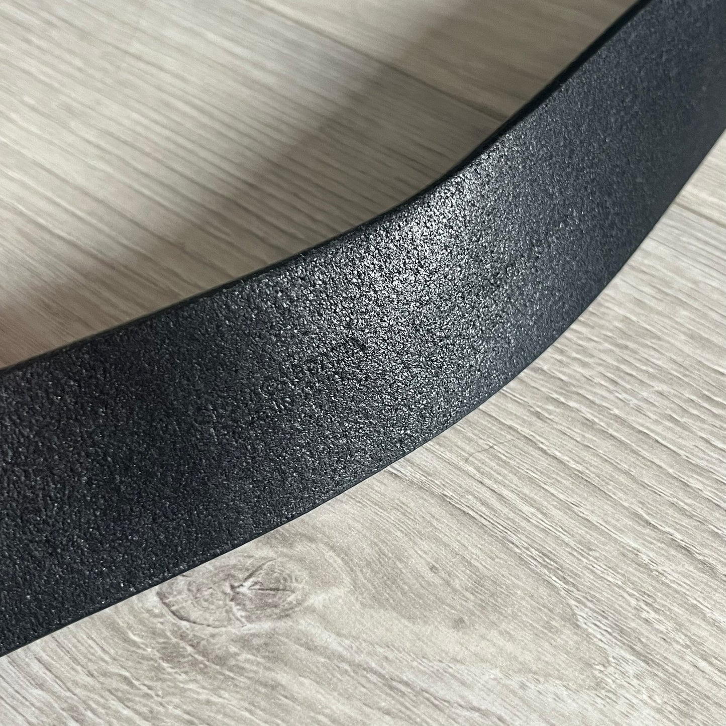 Dolce & Gabbana "Made with Pride" Belt crafted from smooth black Italian leather. Features a circular silver buckle with D&G 94 at the center, surrounded by “Proud to Wear D&G,” “Made with Pride,” and “Established 1994” text. Finished with subtle red and navy accents, combining classic craftsmanship with contemporary flair.