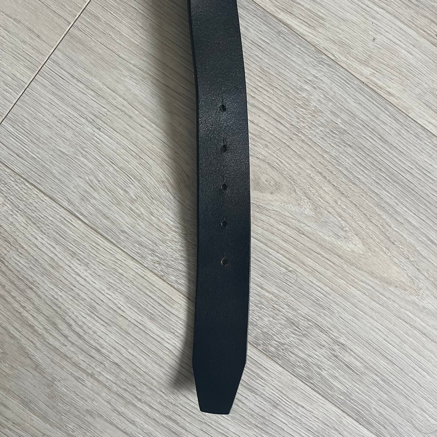 Dolce & Gabbana "Made with Pride" Belt crafted from smooth black Italian leather. Features a circular silver buckle with D&G 94 at the center, surrounded by “Proud to Wear D&G,” “Made with Pride,” and “Established 1994” text. Finished with subtle red and navy accents, combining classic craftsmanship with contemporary flair.