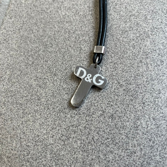Dolce & Gabbana Pearl Red/Black Rosary Necklace from the 2000's era. The necklace features a silver-tone metal cross with a D&G logo, connected via a black leather link to a metal chain with alternating red and black pearl-style beads. Rosary-style construction with mixed materials including metal, leather, and resin pearls. 