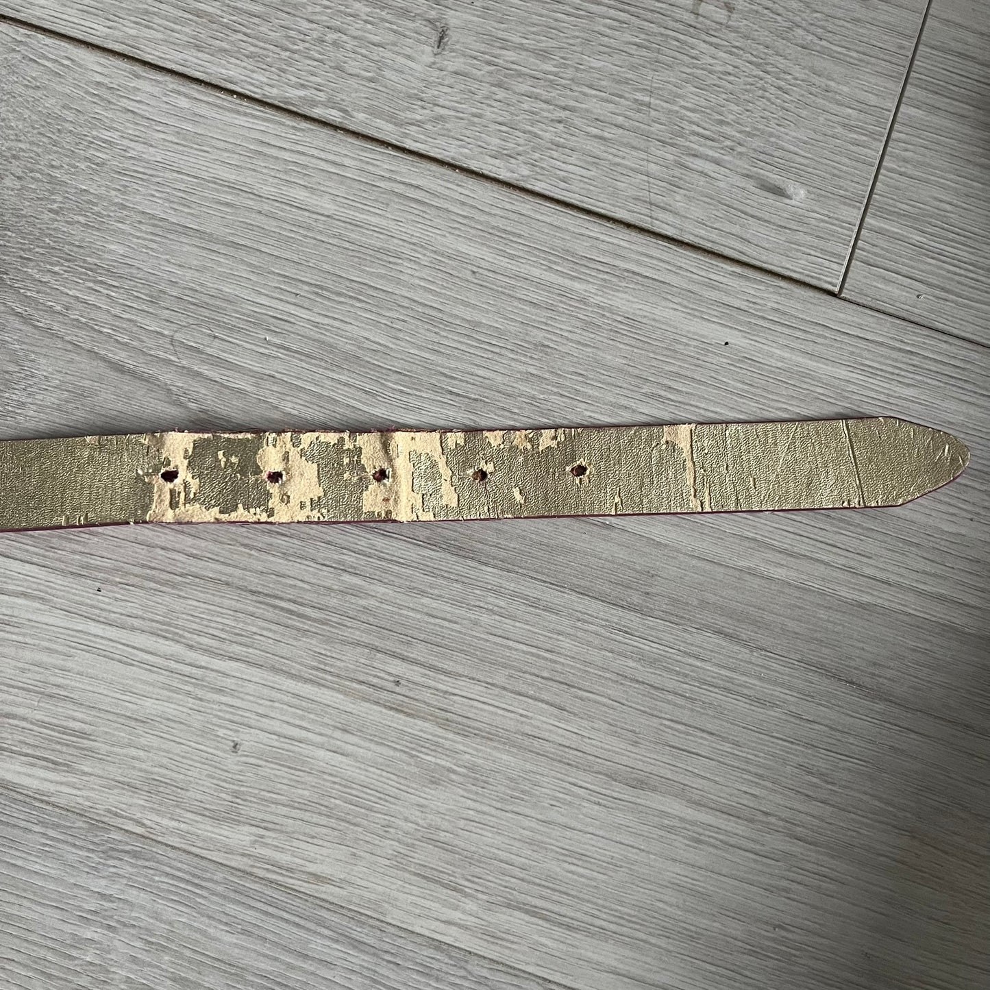 This Dolce & Gabbana Belt combines a slim pink design with a statement D&G buckle framed in gold and accented by visible screws. The inner side of the belt features a gold finish, highlighting the brand’s attention to material contrast. A classic Italian accessory crafted with detailed hardware.