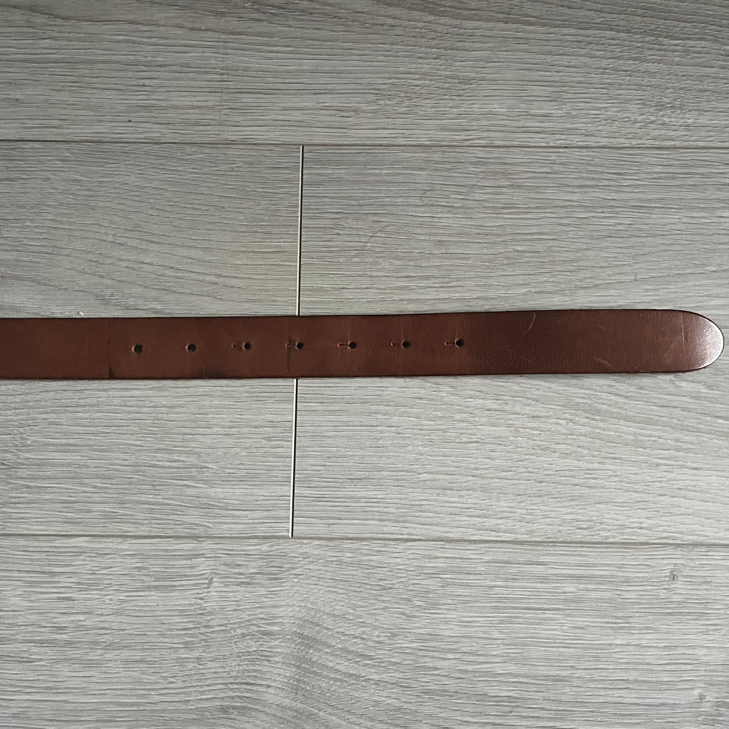 Dolce & Gabbana Red & Blue Leather Belt featuring a rectangular silver-tone buckle with a navy border. The buckle displays a large D&G logo in blue with a red outline and “Dolce & Gabbana” text in blue beneath. Finished with a brown leather strap.