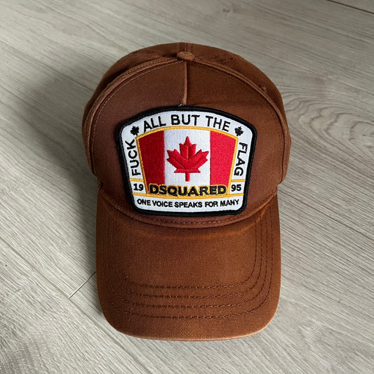 Brown cap with a patch on a wooden surface