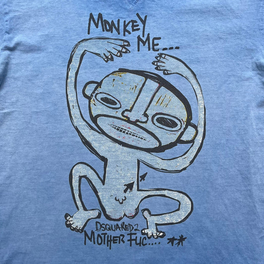 Dsquared2 Blue Rebel Monkey T-Shirt from the Spring/Summer 2015 collection. Crafted in Italy from cotton, the tee features a washed blue finish with darker tonal hems and a lighter faded center. The front displays a large stylized monkey graphic in black with light blue, with text reading “Monkey Me… Dsquared2 Motherfuc…” incorporated into the design.