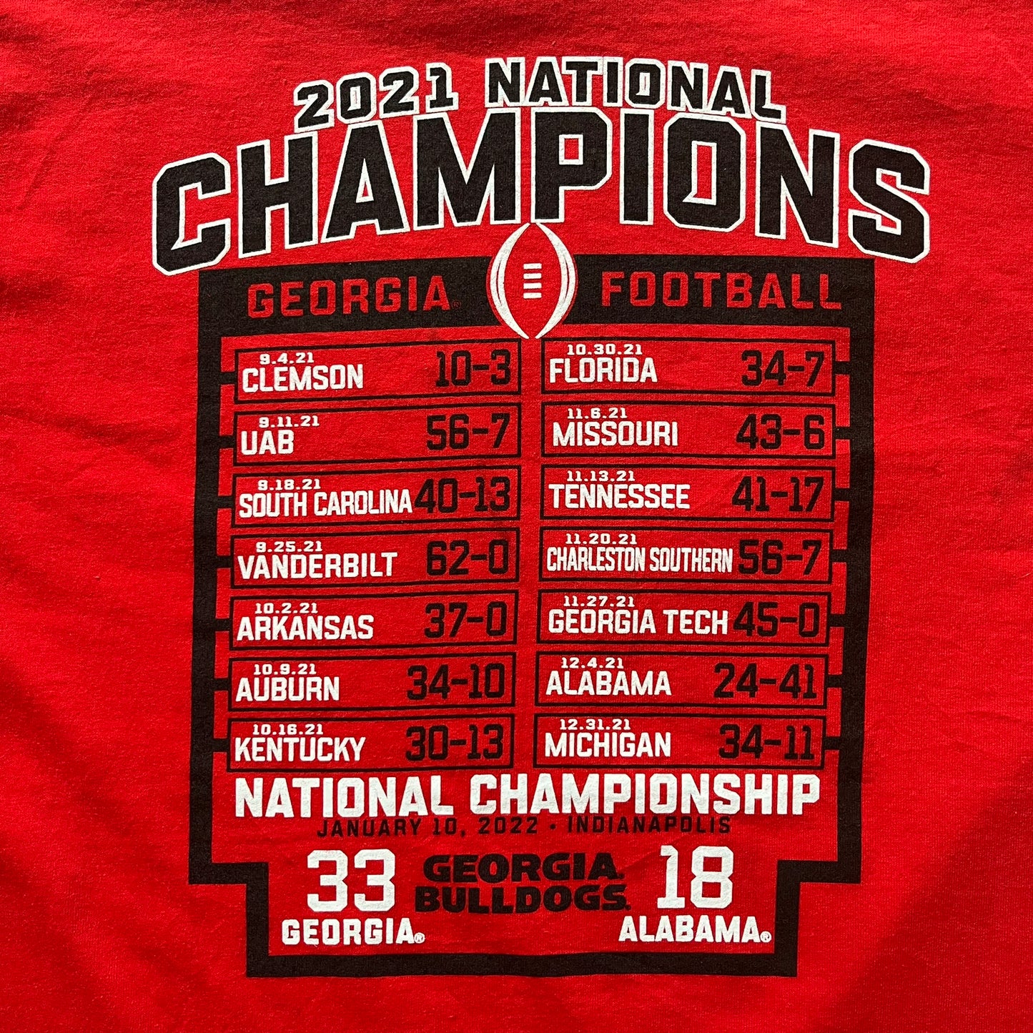 Red t-shirt celebrating the 2021 National Champions Georgia Football with a championship scoreboard.