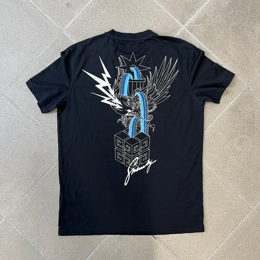 Givenchy AW18 Aquarius Black Tee is a black, slim-fit T-shirt made from 100% cotton, featuring white "GIVENCHY" text on the front alongside a blue half-moon-shaped graphics. The back displays an Aquarius-inspired design in white, gray, and blue, depicting a fountain with a large bird, a cube built from repeated Givenchy logos, and a Givenchy signature.