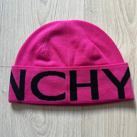 Pink Givenchy Jacquard beanie made from 100% wool and crafted in Italy. Features the black contrasting logo around the rolled brim, splitting “GIVE” and “NCHY” across the hem. Premium construction with a soft, comfortable fit.