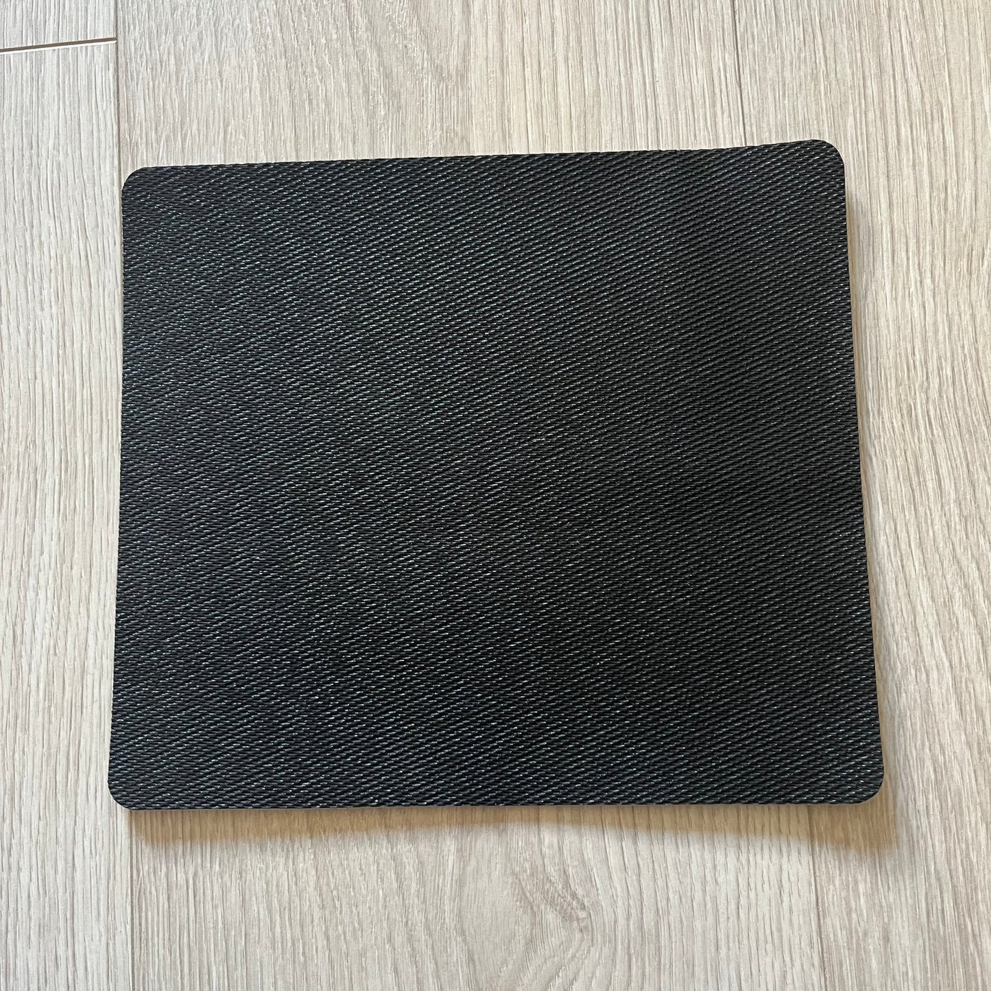 Official Rockstar Games Grand Theft Auto V "iFruit" Mouse Pad. Sleek black hard-plastic surface with a smooth, low-friction finish and the classic iFruit logo in color. Features a durable non-slip rubber base for stability and the Rockstar Games logo at the bottom. Originally available via the Rockstar Warehouse during GTAV’s release period.