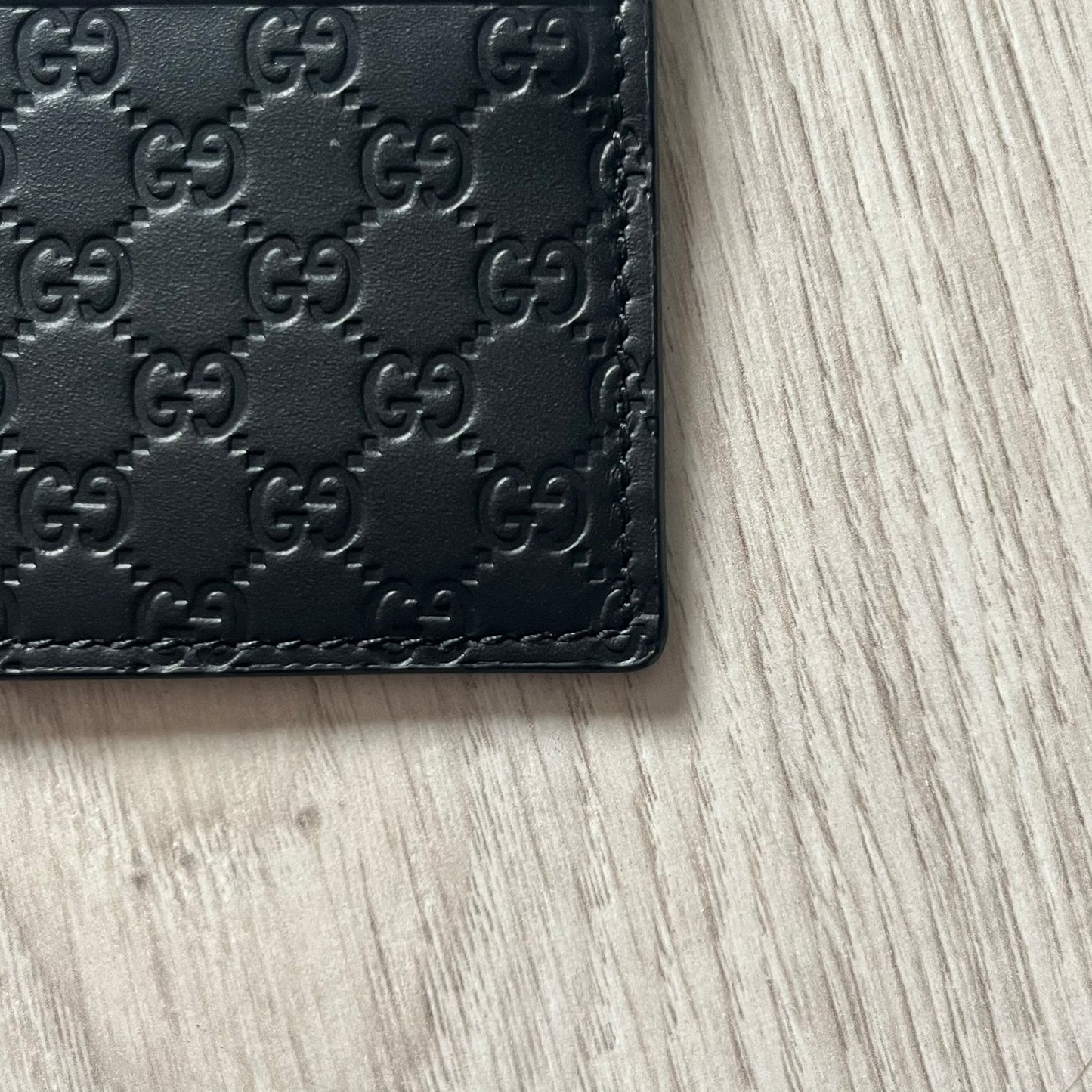 Gucci Microguccissima Black Cardholder crafted in Italy from premium black calf leather with the iconic Microguccissima pattern. Features five card slots, including a central compartment for bills or additional cards. Compact and refined, this Gucci leather card case combines durability with timeless design.