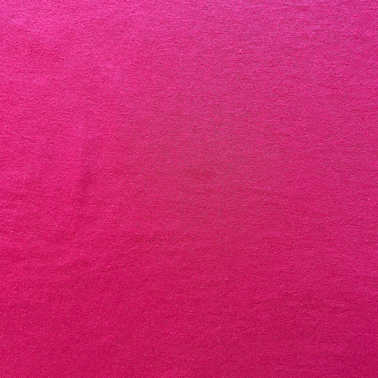 Solid pink color swatch with a textured surface