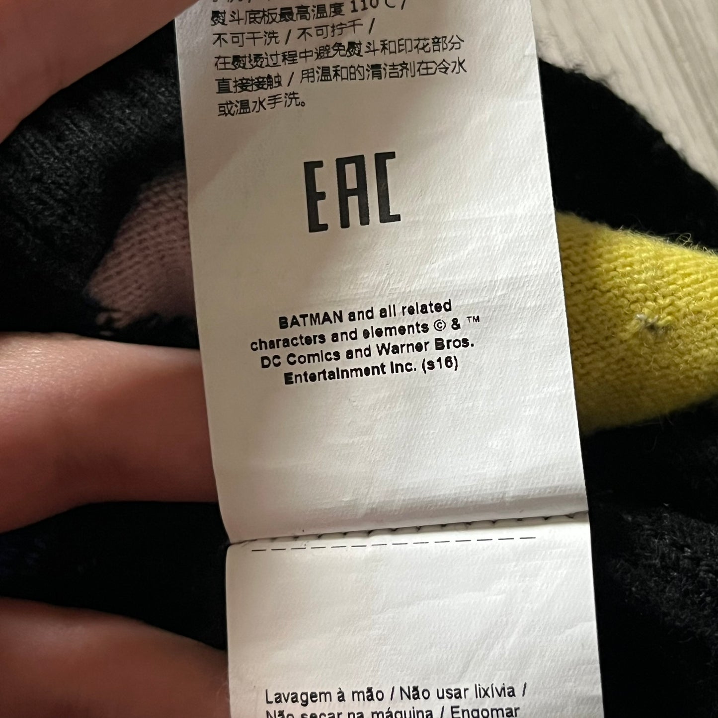 Iceberg Batman 2016 Black Sweater crafted from a premium blend of polyamide, wool, cashmere, and viscose. Features a large woven Batman comic-style graphic on a yellow background with the quote “I’ve got to find him before it’s too late.” Officially licensed by DC, released as part of the Spring/Summer 2016 collection.