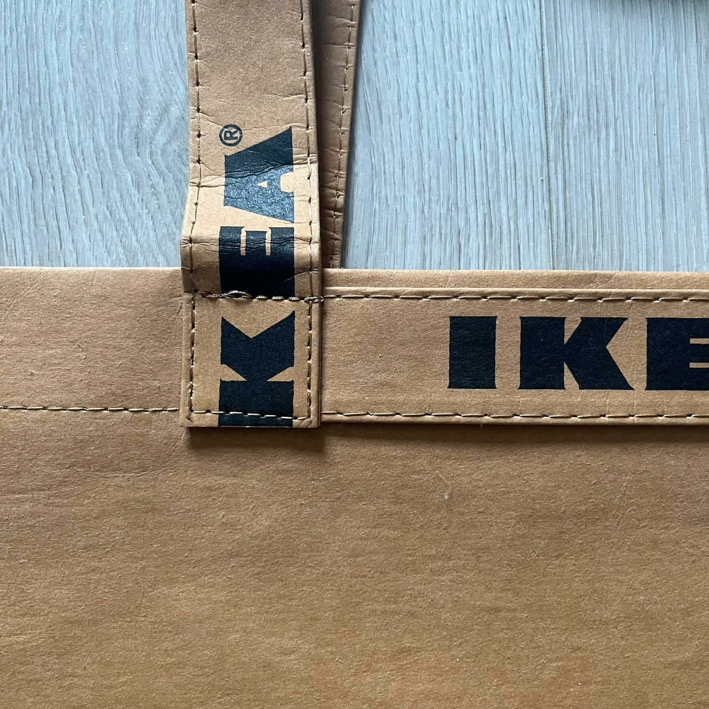 Ikea x Virgil Abloh Markerad "Sculpture" Carrier Bag from FW19 reimagines the iconic blue Frakta tote in reinforced brown paper. Embellished with Abloh’s signature quotation marks, the “SCULPTURE” print transforms a utilitarian object into conceptual design. A collectible symbol of functional art and everyday irony.