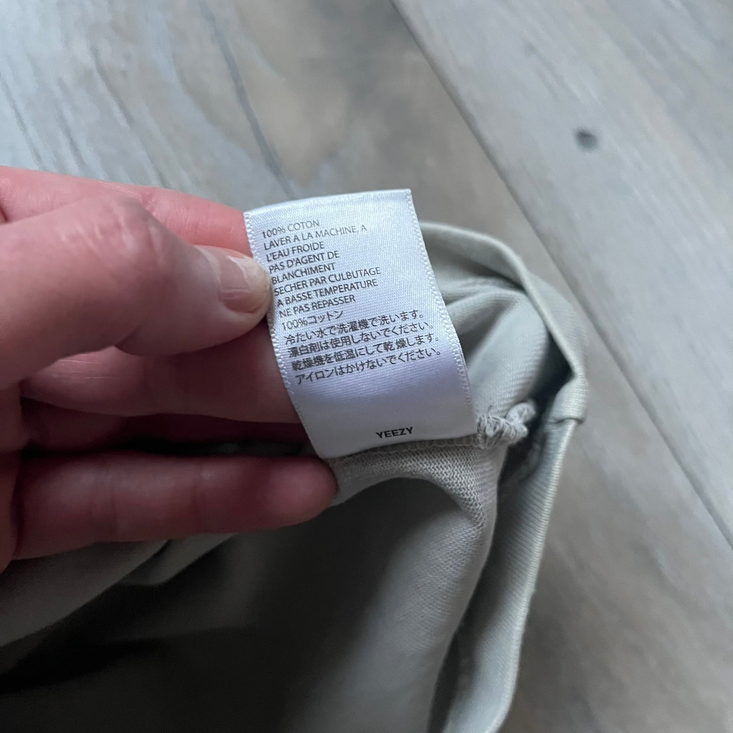 Longsleeve tee from the FW18 Kanye West x Pornhub collection, released 09/07/2018. Vapor color, featuring a front illustration of Riley Reid with her name above and “Top Female Performer” below. Back has the numbers “6918” (futuristic theme set in the year 6918). Includes printed Pornhub tag and YEEZY wash tag, part of a limited run commemorating the 2018 Pornhub Awards.