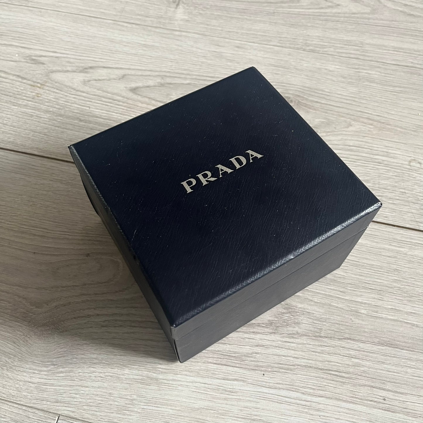 The LG Prada KE850, a groundbreaking collaboration between LG and Prada marked the world’s first capacitive touchscreen phone. Finished in sleek black with minimalist Prada aesthetics, it features media playback, Bluetooth, and expandable memory. Includes the full original Prada set: box, charger, cable, music device, manuals, and CD. Unlocked and functional for basic functions; for calling and texting you need your own SIM card.