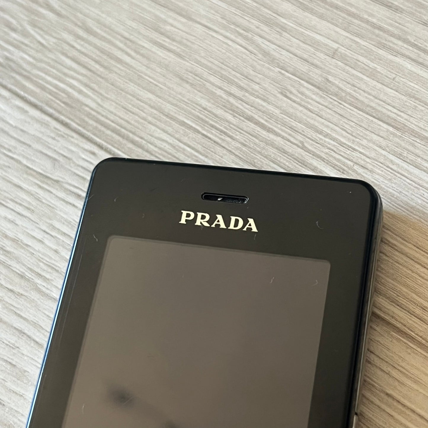 LG Prada KE850 touchscreen phone, the first of its kind with a capacitive display, designed in collaboration with Prada. Sleek black minimalist design, pre-loaded games, PDF and Office support, Bluetooth, and expandable memory. Comes complete with Prada box and leather etui - a collectible milestone in mobile fashion history.