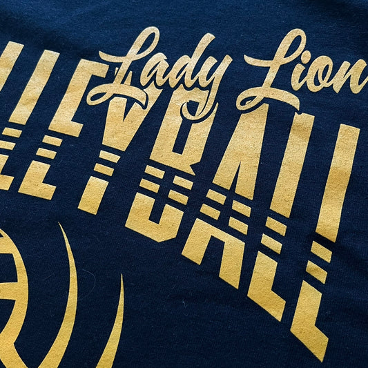 Navy blue shirt with gold 'Lady Lion' text and design