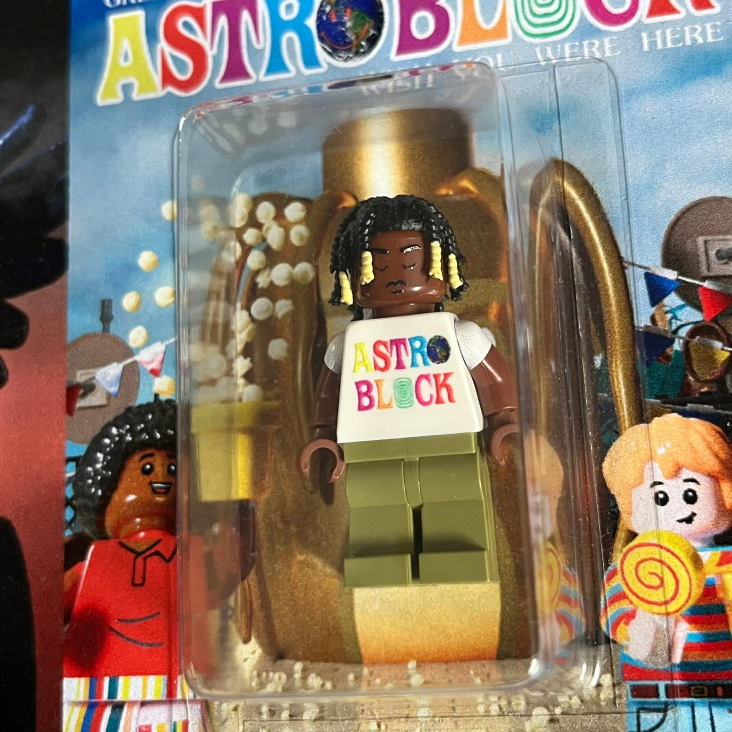 Lego Travis Scott Minifigures Triple Pack featuring three custom figures: Brick Rodeo, Bricks in the Trap, and Astroblock, each inspired and styled after Travis Scott’s iconic album eras. All three are sealed and mounted on a single display card with matching Lego album artwork, a collectible piece created by TheCanvasDon.